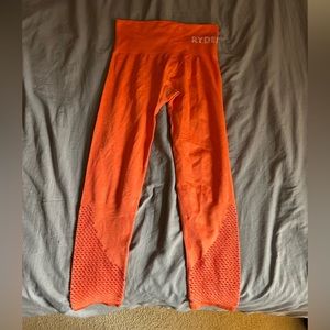 Ryderwear orange leggings, size medium